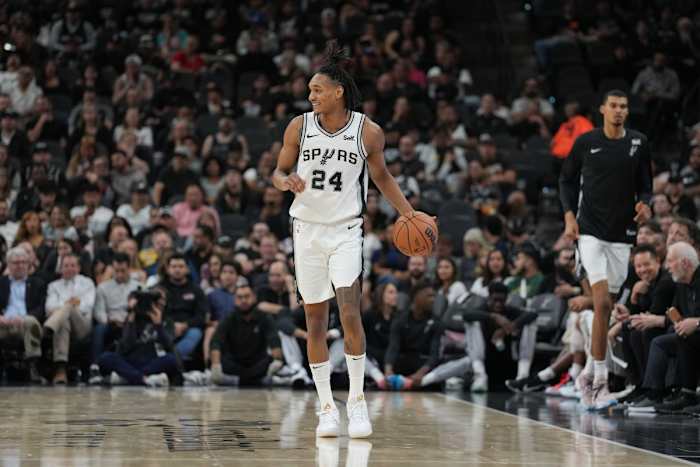 Oct 18, 2023; San Antonio, Texas, USA; San Antonio Spurs guard Devin Vassell (24) brings the ball up the court in the first half against the Houston Rockets at the Frost Bank Center.